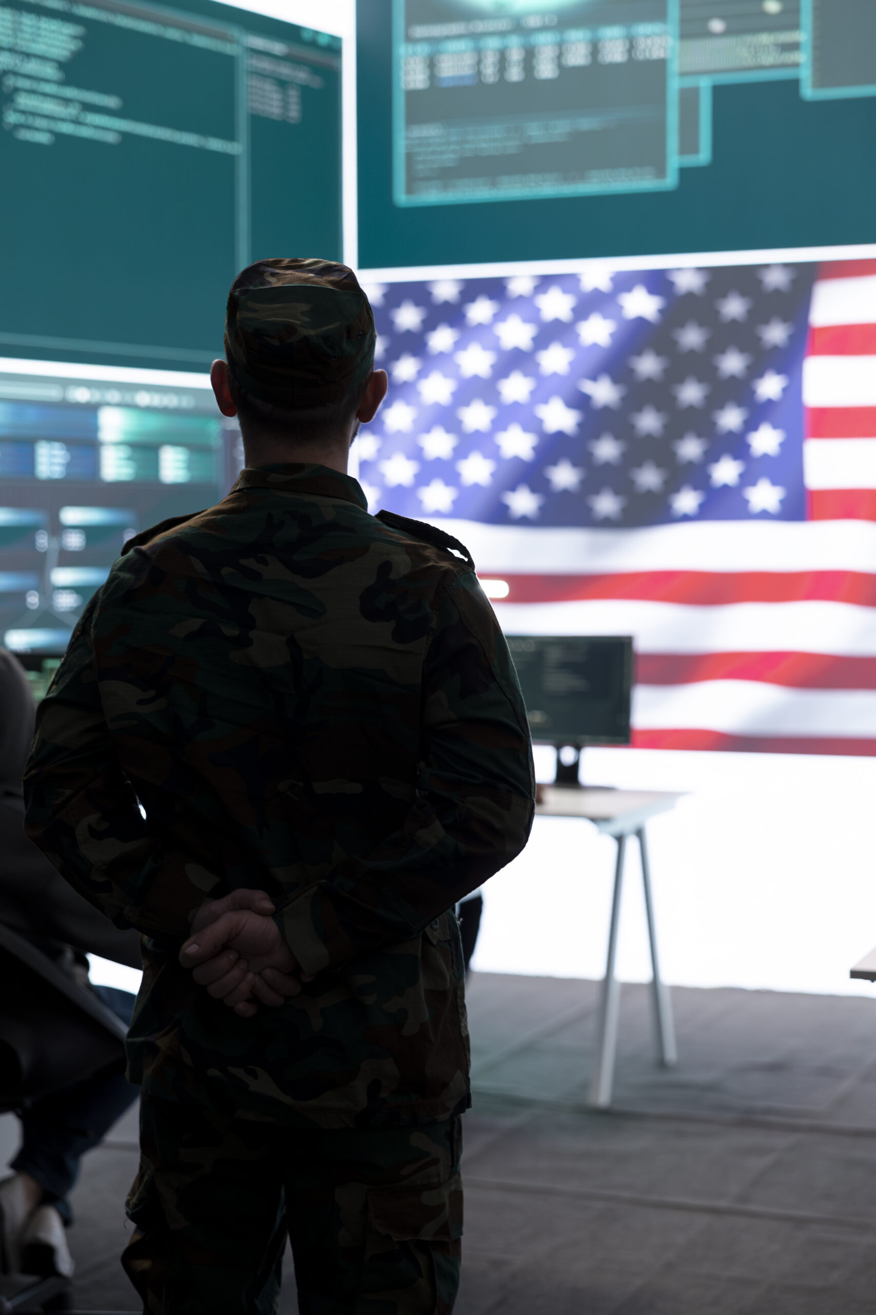 american military personnel supervising cyber warfare high tech office scaled